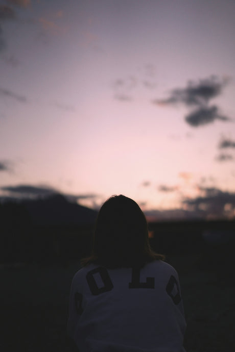 woman in white and black shirt standing during daytime