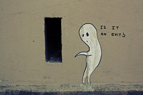 a drawing of a ghost is painted on the side of a building