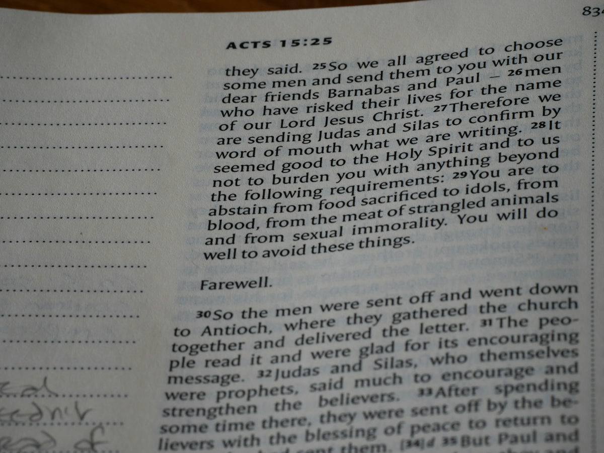 A close up of a book with writing on it