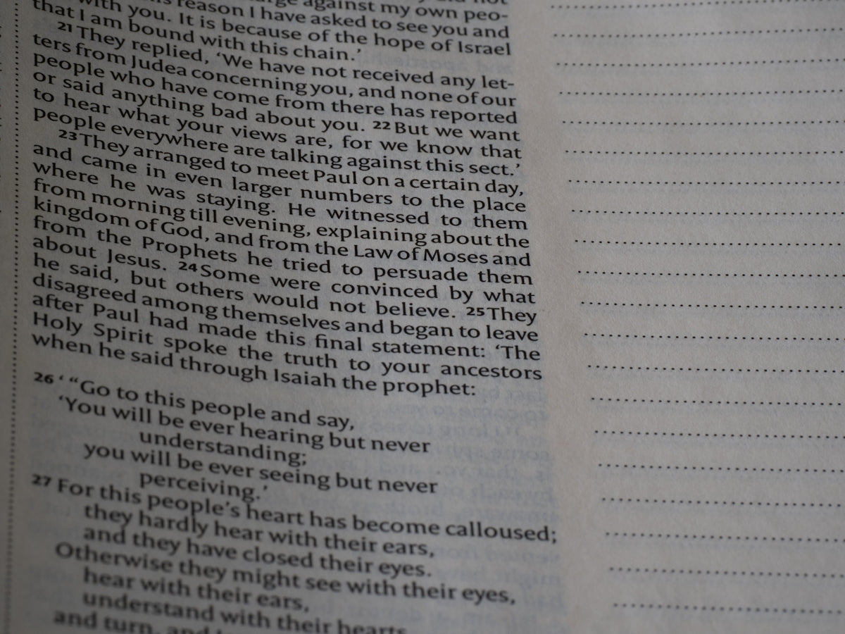 A close up of an open book with words on it