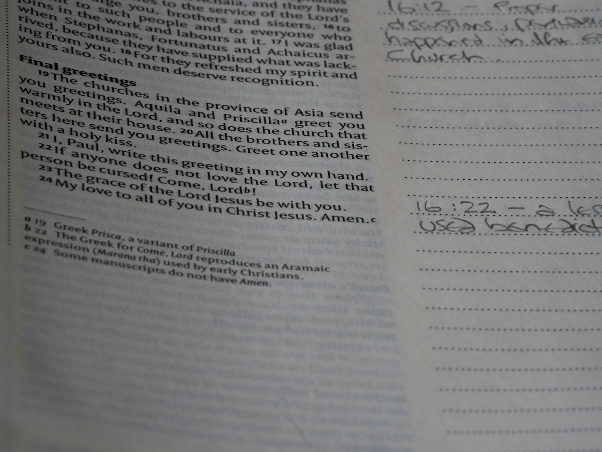A close up of a book with writing on it