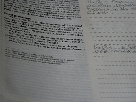 A close up of a book with writing on it