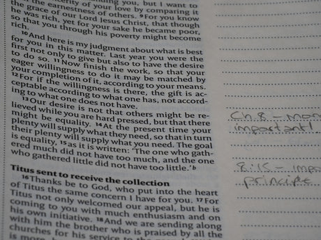 A close up of a book with writing on it