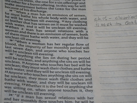 Bible page showing purity laws with handwritten margin notes.