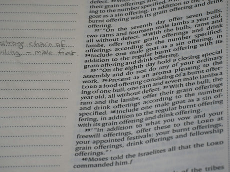 A page of printed text from a book with handwritten notes in the margin